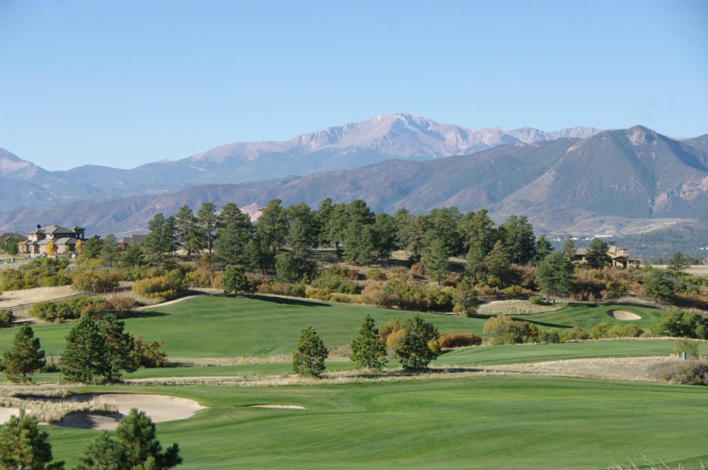 Golf course with mountains in background