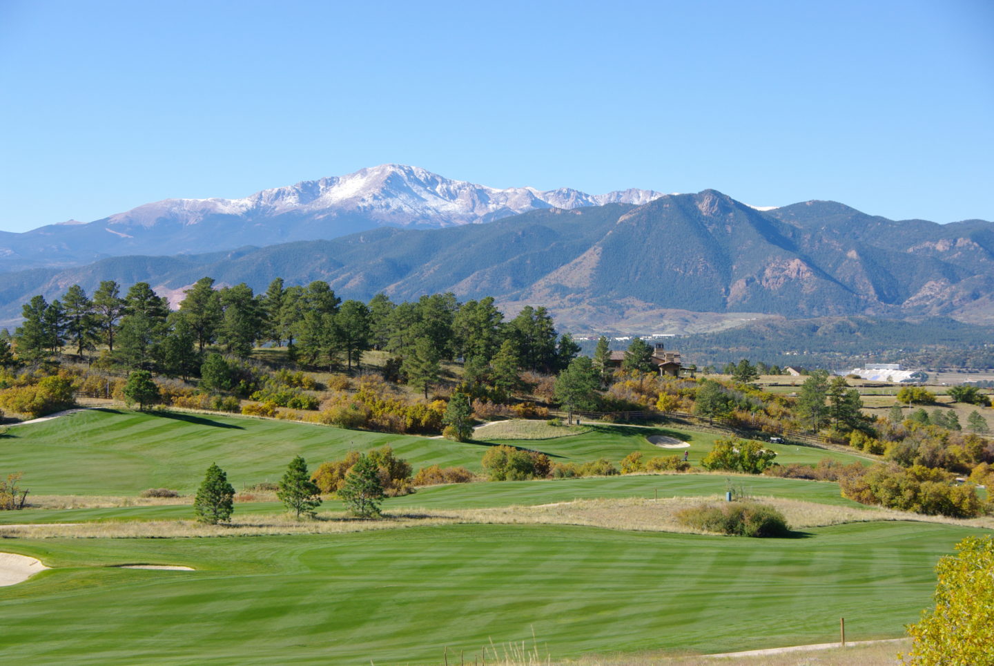Golf course with mountains in background