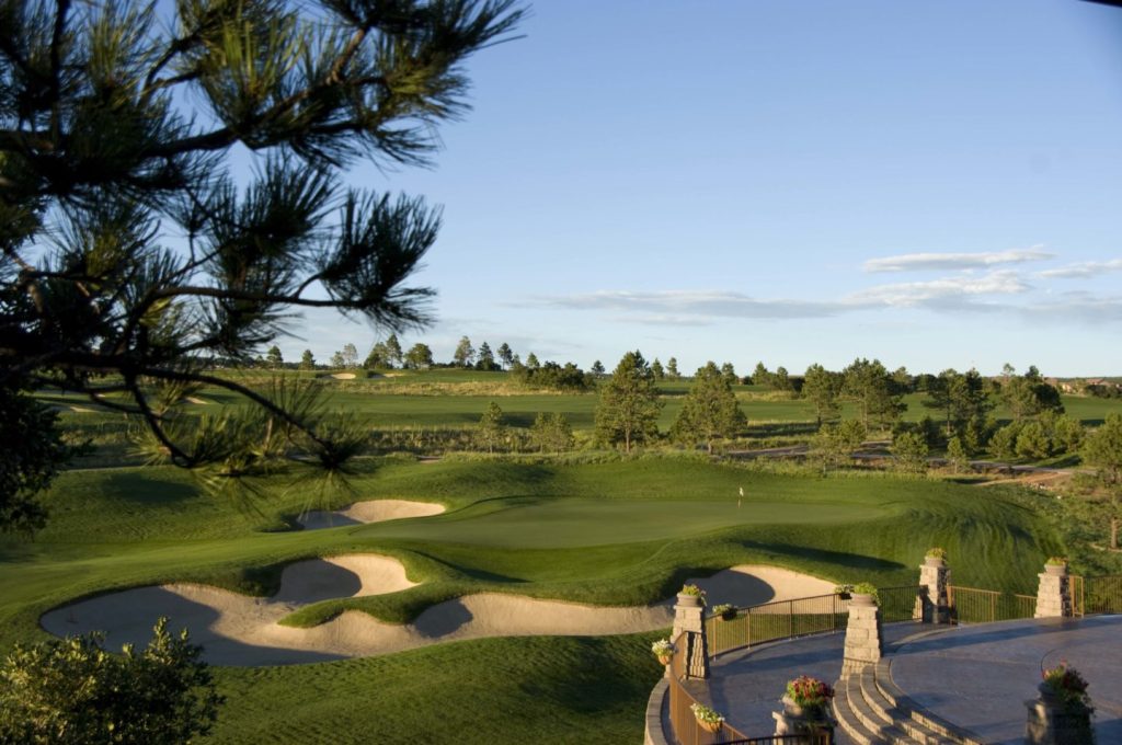 Clubhouse patio facing golf course with bunkers