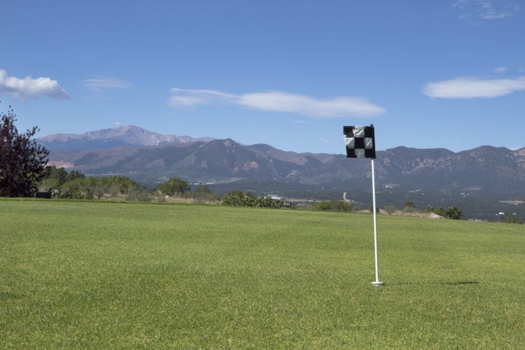 Black and white checkered flag on golf course